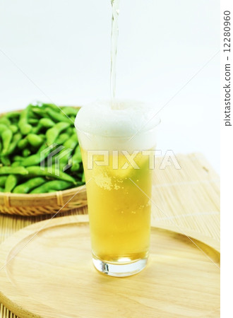 Summer taste · Edamame bean sprouts on cold beer · White back vertical position 12280960