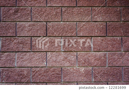 The wall of the large cherry-colored rectangular stones as backg The wall of the large cherry-colored rectangular stones as backg 12281699