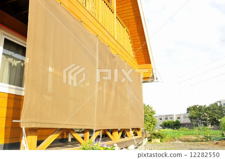 Sunshade installed in a log house Sunshade installed in a log house 12282550