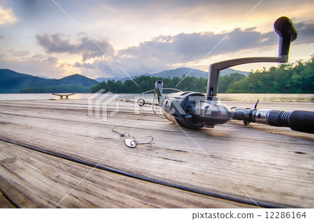fishing tackle on a wooden float with mountain background in nc fishing tackle on a wooden float with mountain background in nc 12286164