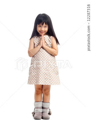 Asian child greeting with sawasdee 12287316