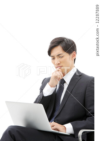 Businessman / laptop computer Businessman / laptop computer 12287889