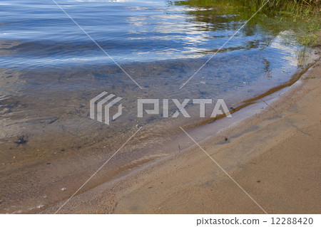 quiet surf on the sandy shore of Istra 12288420