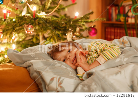 Little cute blond boy sleeping under Christmas tree Little cute blond boy sleeping under Christmas tree 12291612