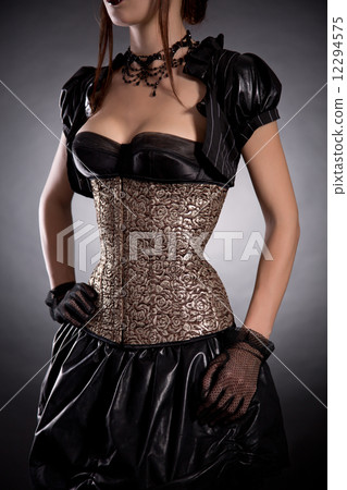 Attractive young woman in Victorian style costume and rose corse 12294575