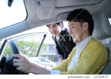 Salesman who explains the car Salesman who explains the car 12294677