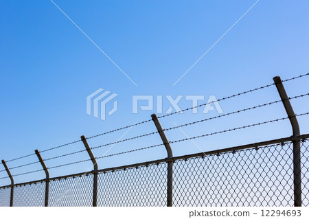 Fence with barbed wire 12294693