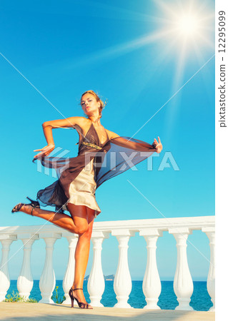 fashion model by the sea in Greece 12295099
