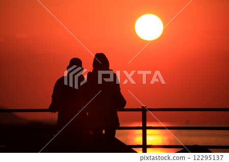 Sunset and parent and child Sunset and parent and child 12295137