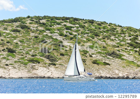 yacht with white sail near Dalmatia coast 12295789