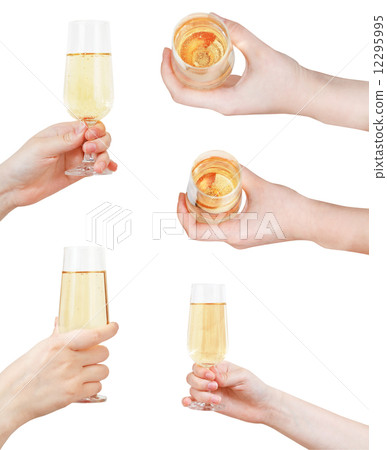 set of hand holding glass with sparkling wine set of hand holding glass with sparkling wine 12295995