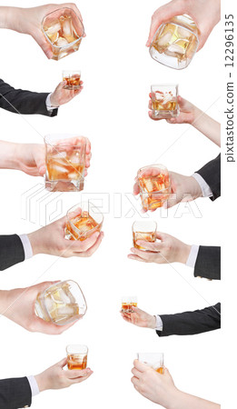set of whiskey with ice glass in hand 12296135