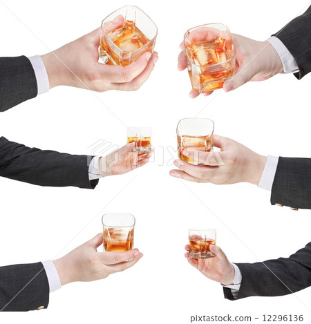 set of whiskey glass in businessman hand 12296136