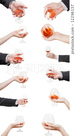 set of brandy glasses in hand isolated 12296137
