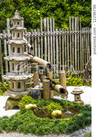Pagada stone and  bamboo fountain in japanese garden 12296786