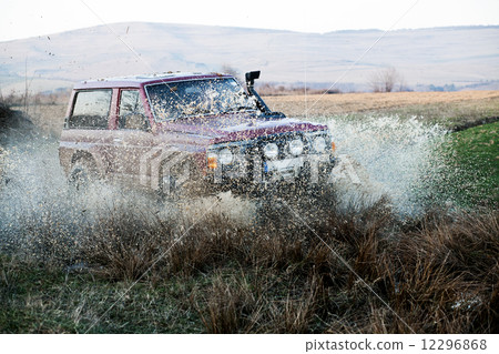 Off road car in mud Off road car in mud 12296868