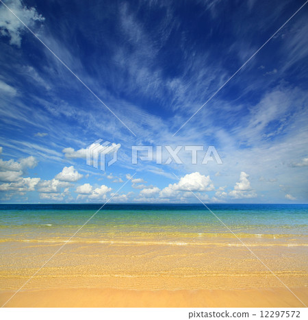 landscape with gold sand beach and clouds 12297572