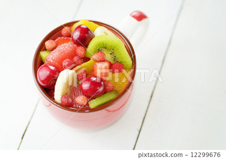 Red cup with fruits Red cup with fruits 12299676