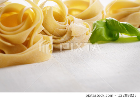 Raw pasta tagliatelle Raw pasta tagliatelle 12299825