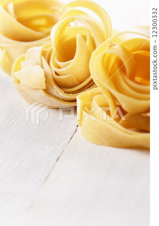 Raw pasta tagliatelle 12300332