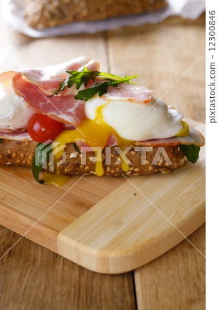 Bacon and poached eggs sandwich Bacon and poached eggs sandwich 12300846