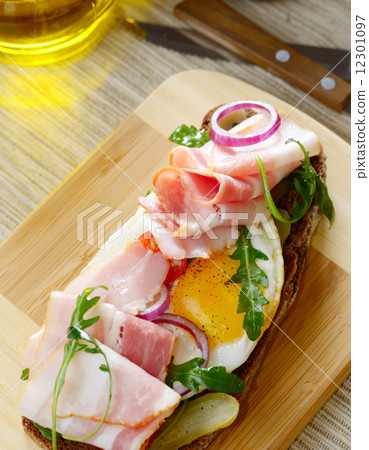 Bacon and fried eggs open sandwich Bacon and fried eggs open sandwich 12301097