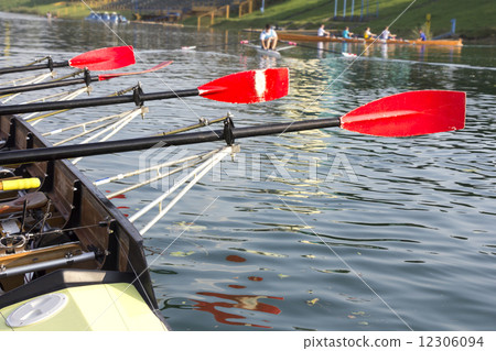 Boat with a red paddle 12306094