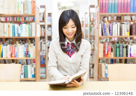 School girls studying at the library 12306148