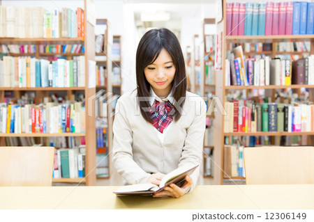 School girls studying at the library 12306149