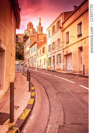 view of Notre Dame de la Garde in the evening at sunset. The Fre view of Notre Dame de la Garde in the evening at sunset. The Fre 12307770