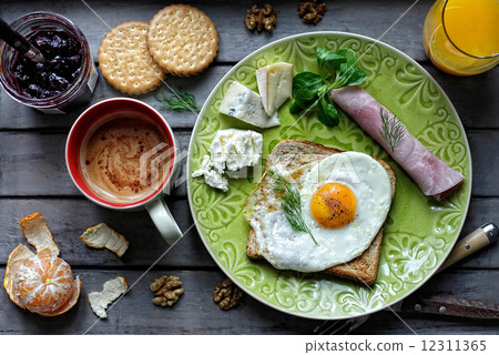Breakfast with an egg on a toast Breakfast with an egg on a toast 12311365