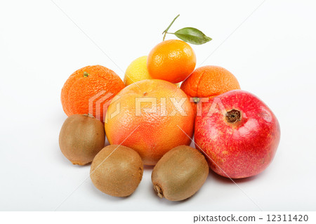 pomegranates and citrus fruits isolated on a white background. pomegranates and citrus fruits isolated on a white background. 12311420