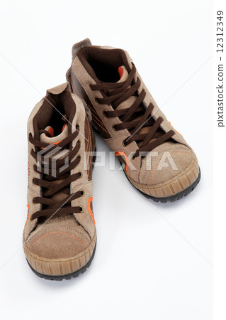 A pair of new hiking boots on white background A pair of new hiking boots on white background 12312349
