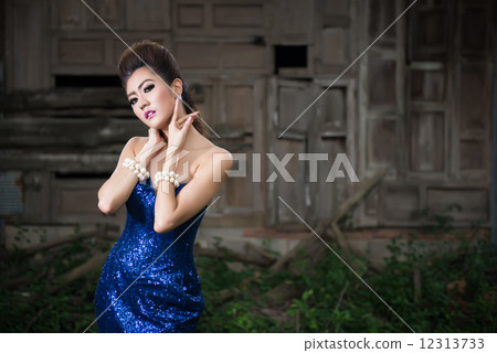 Beautiful lady in luxury blue dress with pearl Beautiful lady in luxury blue dress with pearl 12313733