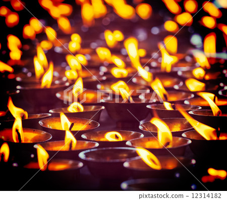 Burning candles in Buddhist temple, McLeod Ganj 12314182