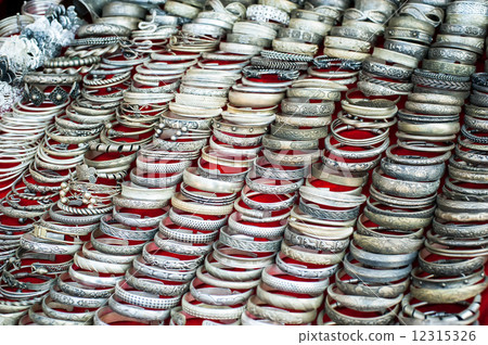 Cheap souvenir bangles at asian market. Laos Cheap souvenir bangles at asian market. Laos 12315326