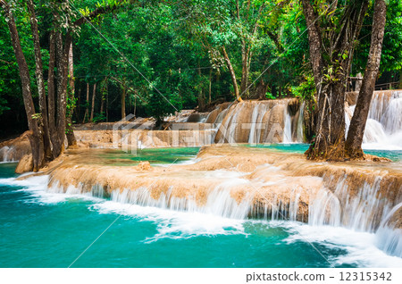 Jangle landscape with turquoise water of Kuang Si waterfall. Laos Jangle landscape with turquoise water of Kuang Si waterfall. Laos 12315342