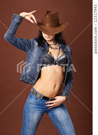 Beautiful sexy girl in jeans and cowboy hat Beautiful sexy girl in jeans and cowboy hat 12317943