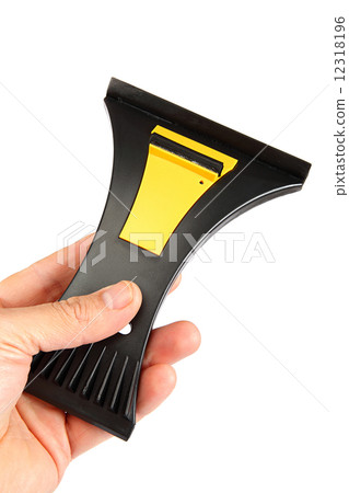 Scraper in hand on white background. 12318196