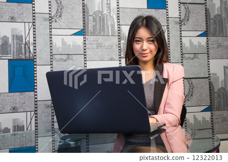 Office lady looking at you while working 12322013