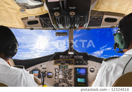 Pilots in the plane cockpit and sky 12324818