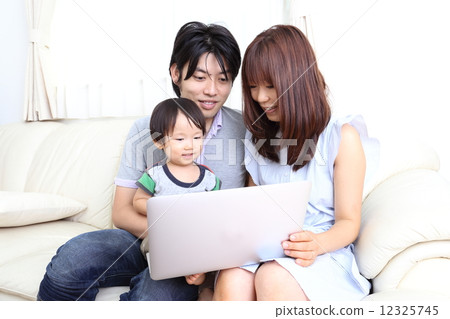 Three parents watching laptop Three parents watching laptop 12325745