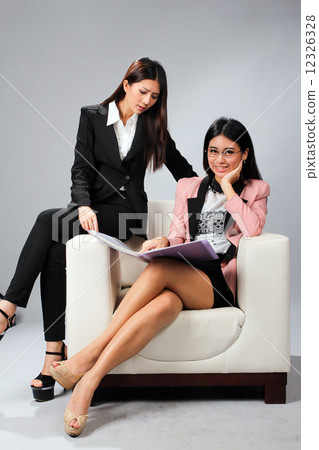 Business executives looking at file 12326328