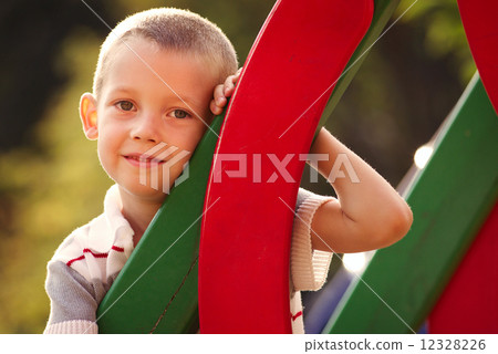 Cute little boy in a colorful kids playground 12328226