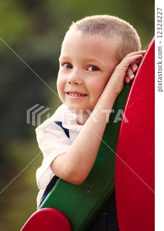 Cute little boy in a colorful kids playground 12328227
