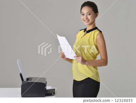 Asian Office Lady printing out documnet Asian Office Lady printing out documnet 12328855