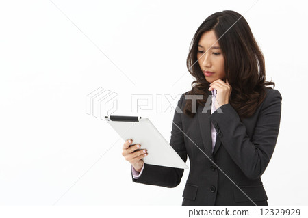 Asian business woman using tablet 12329929