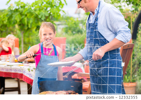 Barbecue with family in the garden Barbecue with family in the garden 12332355