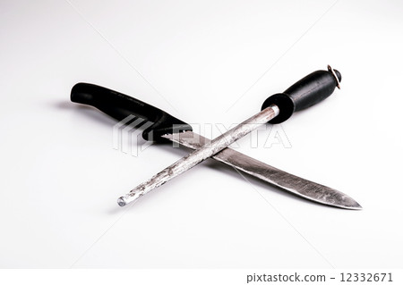 Knife and whetstone isolated on white background 12332671
