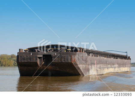 Big black cargo barge is anchored on the Danube river 12333093
